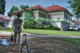 jose rizal shrine with statue of jose rizal and dog